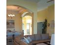 Spacious living room with leather sectional sofa and dining area at 5452 Club View Ln, North Port, FL 34287