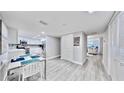 Dining area next to the kitchen boasts modern table, chairs, and neutral decor at 14820 Rue De Bayonne # 308, Clearwater, FL 33762