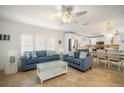 Bright living room with comfy sofas and tiled floors at 215 75Th St, Holmes Beach, FL 34217