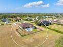 Aerial view of the rear of this single Gathering home, highlighting the pool and expansive backyard at 3310 Twin Rivers Trl, Parrish, FL 34219