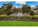 Stone community sign surrounded by lush landscaping at 3310 Twin Rivers Trl, Parrish, FL 34219