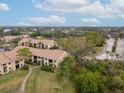 Aerial view of community featuring multiple buildings and green spaces at 4001 Crockers Lake Blvd # 11, Sarasota, FL 34238