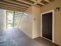 Building entrance with dark brown door and nearby stairs at 4001 Crockers Lake Blvd # 11, Sarasota, FL 34238