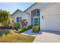 Inviting home showcasing beautiful landscaping and a well-manicured lawn at 4018 38Th W St, Bradenton, FL 34205
