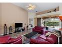 Comfortable living room featuring stylish decor, tile flooring, and seamless transition to the outdoor patio at 6211 Skyward Ct, Bradenton, FL 34203