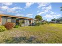 The backyard includes a lawn, various bushes, and a porch at 6314 29Th W Ave, Bradenton, FL 34209