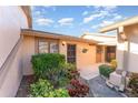 Inviting home entrance with a well-maintained garden and a cozy, welcoming atmosphere at 6314 29Th W Ave, Bradenton, FL 34209