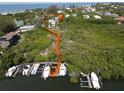 Elevated view showcasing home's access to a private dock and marina at 6330 Laguna Dr, Longboat Key, FL 34228