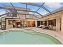 Inviting pool and spa with covered patio, ideal for outdoor entertaining at 7033 Brier Creek Ct, Lakewood Ranch, FL 34202