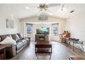 Gathering room with a fireplace and plenty of natural light at 949 Chevy Chase St, Port Charlotte, FL 33948