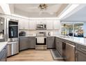 Modern kitchen with stainless steel appliances and gray cabinets at 949 Chevy Chase St, Port Charlotte, FL 33948