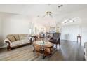 Bright living room featuring hardwood floors and comfortable seating at 949 Chevy Chase St, Port Charlotte, FL 33948