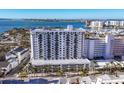 Expansive aerial view of a modern condo building with marina and water views at 101 S Gulfstream Ave # 5K, Sarasota, FL 34236