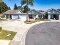 Wider aerial view showcasing multiple homes and landscape at 104 Carswell Cir # 10, Sun City Center, FL 33573