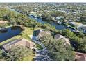 Aerial view of house and property, showcasing curb appeal and waterfront lot at 1060 Water Oak Ne Ct, St Petersburg, FL 33703