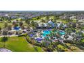 Expansive community pool and recreation area complete with playground and sun loungers at 11794 Little River Way, Parrish, FL 34219