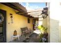 Inviting entryway with a pergola, bench, and lush greenery at 1430 57Th W St # 1430, Bradenton, FL 34209