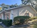 Side view of a single story home showcasing its light beige exterior at 1535 Nursery Rd # 107, Clearwater, FL 33756