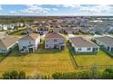 Aerial view of houses, showing backyard and community at 17209 Barnwood Pl, Bradenton, FL 34211