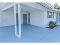 Covered carport with access to front door at 1752 Banyan Dr, Venice, FL 34293