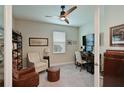 Bright home office with built-in shelving, comfortable seating, and a workspace at 17723 Gulf Ranch Pl, Lakewood Ranch, FL 34211