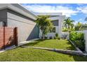 Landscaped front yard with a small tree and stone border at 2254 Hawthorne St, Sarasota, FL 34239