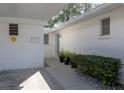 Inviting front entrance with a walkway, garden, and a freshly painted white exterior at 2321 Terry Ln, Sarasota, FL 34231