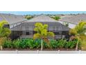 Screened pool and patio with lush landscaping at 2582 Wild Cherry Path, Sarasota, FL 34240