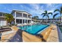 Community pool with surrounding lounge chairs and patio area at 3101 Bee Ridge Rd # 118, Sarasota, FL 34239