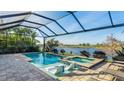 Stunning screened pool and spa offer water views, perfect for relaxation and outdoor entertaining at 508 Wildlife Gln, Bradenton, FL 34209