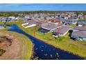 Aerial view showcasing a home with a pool and canal-front location at 8547 40Th E Cir, Palmetto, FL 34221