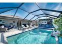 Inviting pool area with covered lanai, bar, and lounge chairs at 8547 40Th E Cir, Palmetto, FL 34221