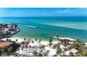 Aerial view showcasing beach, water, and boat at 9 Sandy Cove Rd # 8A, Sarasota, FL 34242