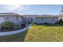 House exterior showcasing walkway and landscaping at 1006 Pine Forest Ct, Venice, FL 34293