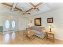 Comfortable living room with a unique decorative ceiling and an abundance of natural light at 1346 Queen Rd, Venice, FL 34293