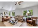 Bright living room with hardwood floors and large windows at 14018 Pine Woods E Ln, Sarasota, FL 34240