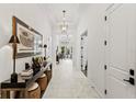 Bright entryway featuring neutral walls and flooring, high ceilings and stylish décor at 16730 Collingtree Xing, Lakewood Ranch, FL 34202