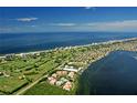 Aerial of coastal community near beach and golf course at 360 Gulf Of Mexico Dr # 332, Longboat Key, FL 34228