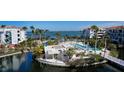 Resort-style pool and patio area on waterfront at 360 Gulf Of Mexico Dr # 332, Longboat Key, FL 34228