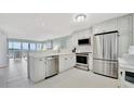 Modern kitchen with stainless steel appliances and white cabinetry at 4430 Exeter Dr # 104, Longboat Key, FL 34228