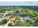 Luxury community with lake, mature trees and custom homes at 4431 Camino Real, Sarasota, FL 34231