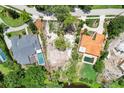 Two homes with pools and a vacant lot between at 4431 Camino Real, Sarasota, FL 34231