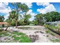 Cleared homesite ready for construction with lake view at 4431 Camino Real, Sarasota, FL 34231