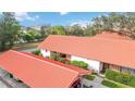 Aerial view of condo building showcasing red tile roofs at 6666 Draw Ln # 132, Sarasota, FL 34238