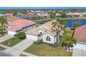 An aerial view of a house with a lake view at 6978 Superior Street Cir, Sarasota, FL 34243