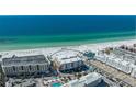 Expansive aerial view of beachfront condos with stunning ocean views and white sands at 1035 Seaside Dr # 503, Sarasota, FL 34242