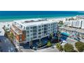 Stunning exterior view of a modern beachfront condo building near the white sands at 1035 Seaside Dr # 503, Sarasota, FL 34242