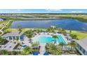 Resort-style pool with lounge chairs, cabanas, and lush landscaping at 17903 Palmiste Dr, Bradenton, FL 34202