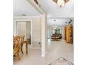 Spacious living room with tiled floors and brown couches at 3273 Wentworth St, North Port, FL 34288