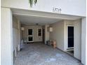 View of tiled carport featuring entry doors into the home at 3739 Collins St # 701, Sarasota, FL 34232